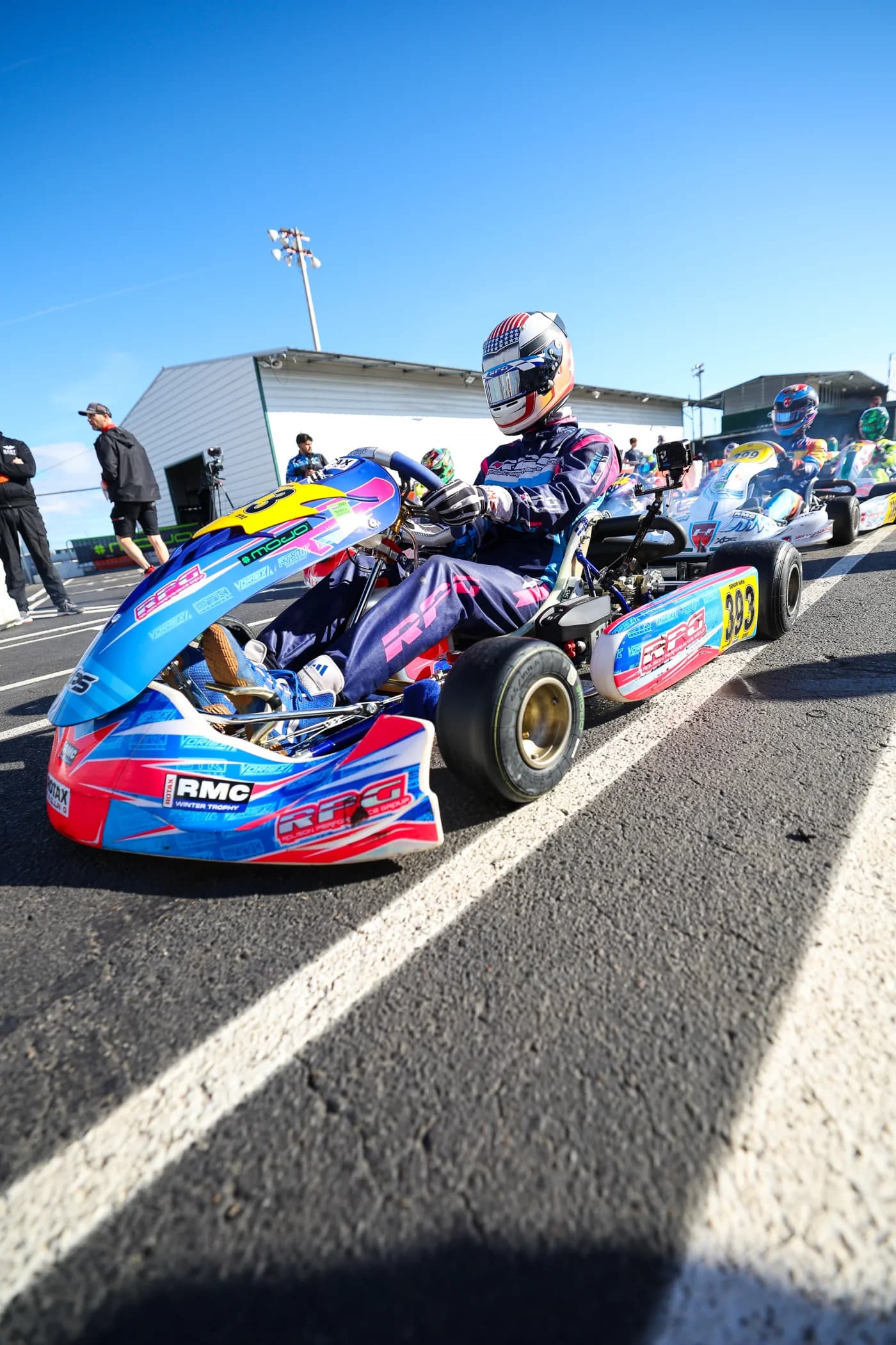 Liam Gray on the grid in kart 393, shot low from the tarmac