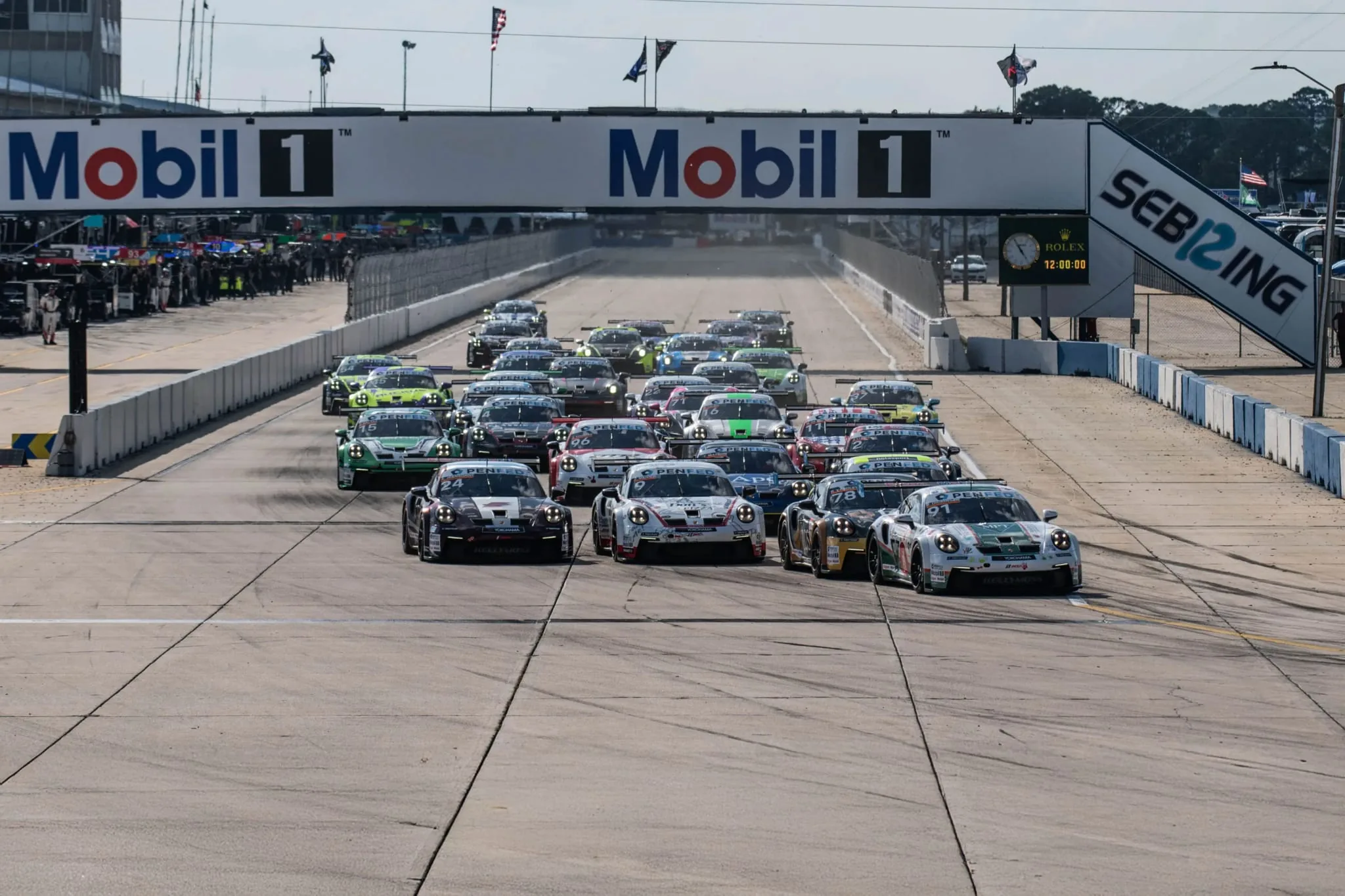 The Carrera Cup field taking the start under the Mobil 1 bridge at Sebring