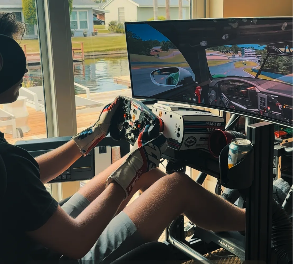 Liam Gray on the simulator rig learning a circuit before the event