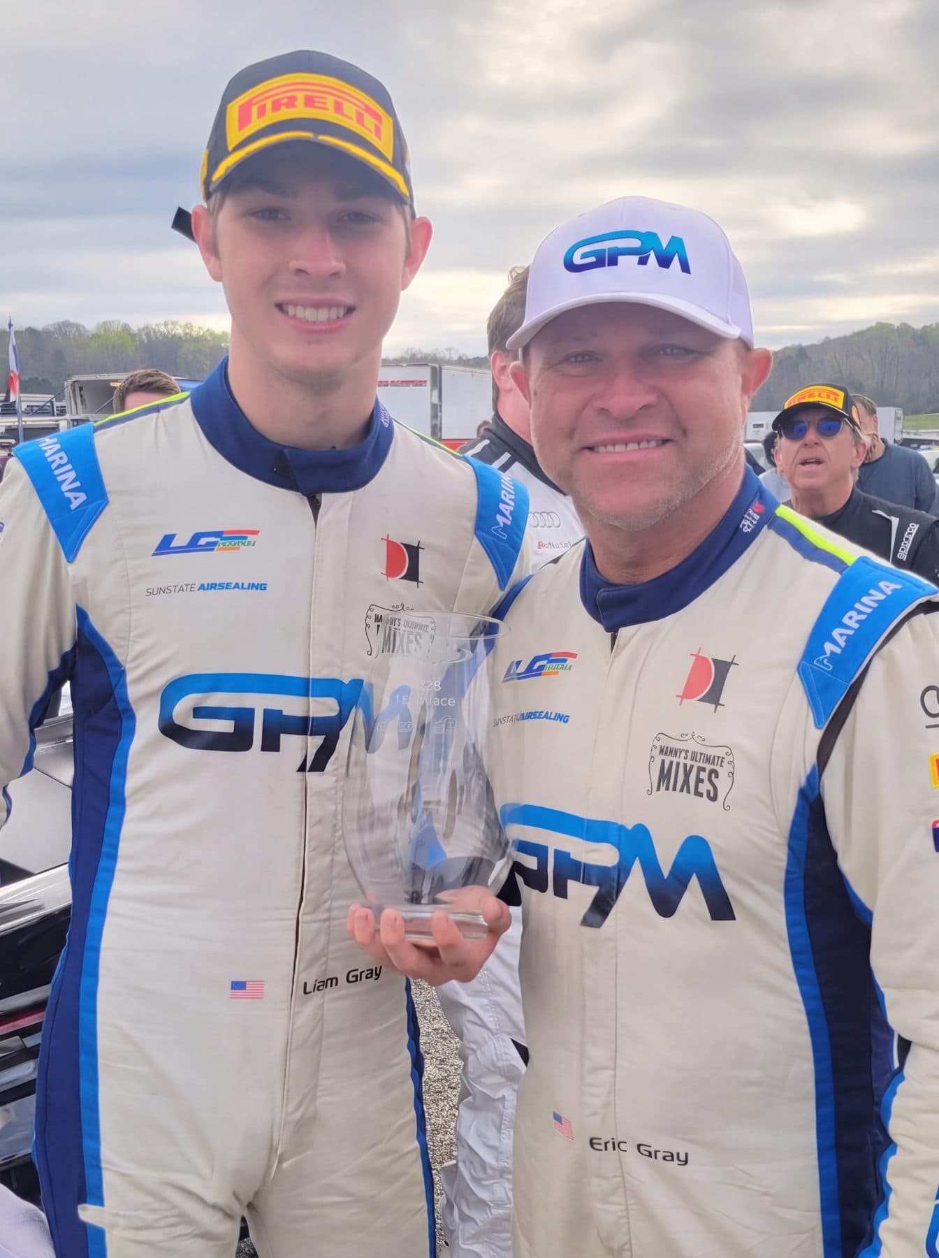 Liam Gray with his father Eric in the shop